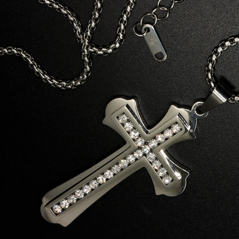 This Lux Haus Saints cross pendant is iced out with authentic Grade AAA CZ Diamonds