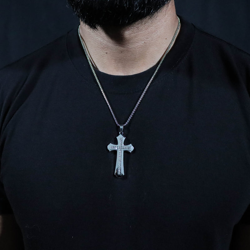 This Lux Haus Saints cross pendant is iced out with authentic Grade AAA CZ Diamonds